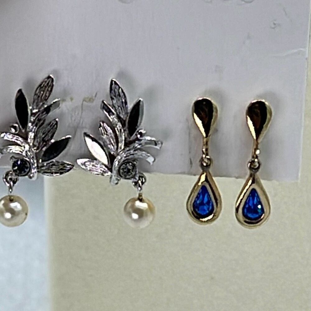 Two pair vintage Avon clip earrings. One silver and one gold colored